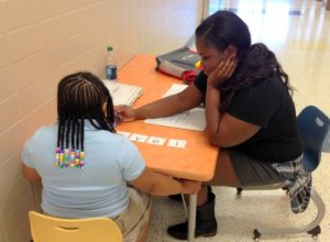 Literacy Lab tutor completing letter sound correspondence activity with student