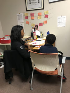 KC K-3 tutor working with student at Melcher Elementary