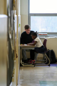 Literacy Lab tutor completing interventions with a student in DC