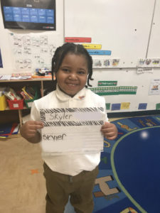 Pre-K student demonstrating Sign-In activity