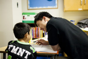 Baltimore K-3 tutor working with student